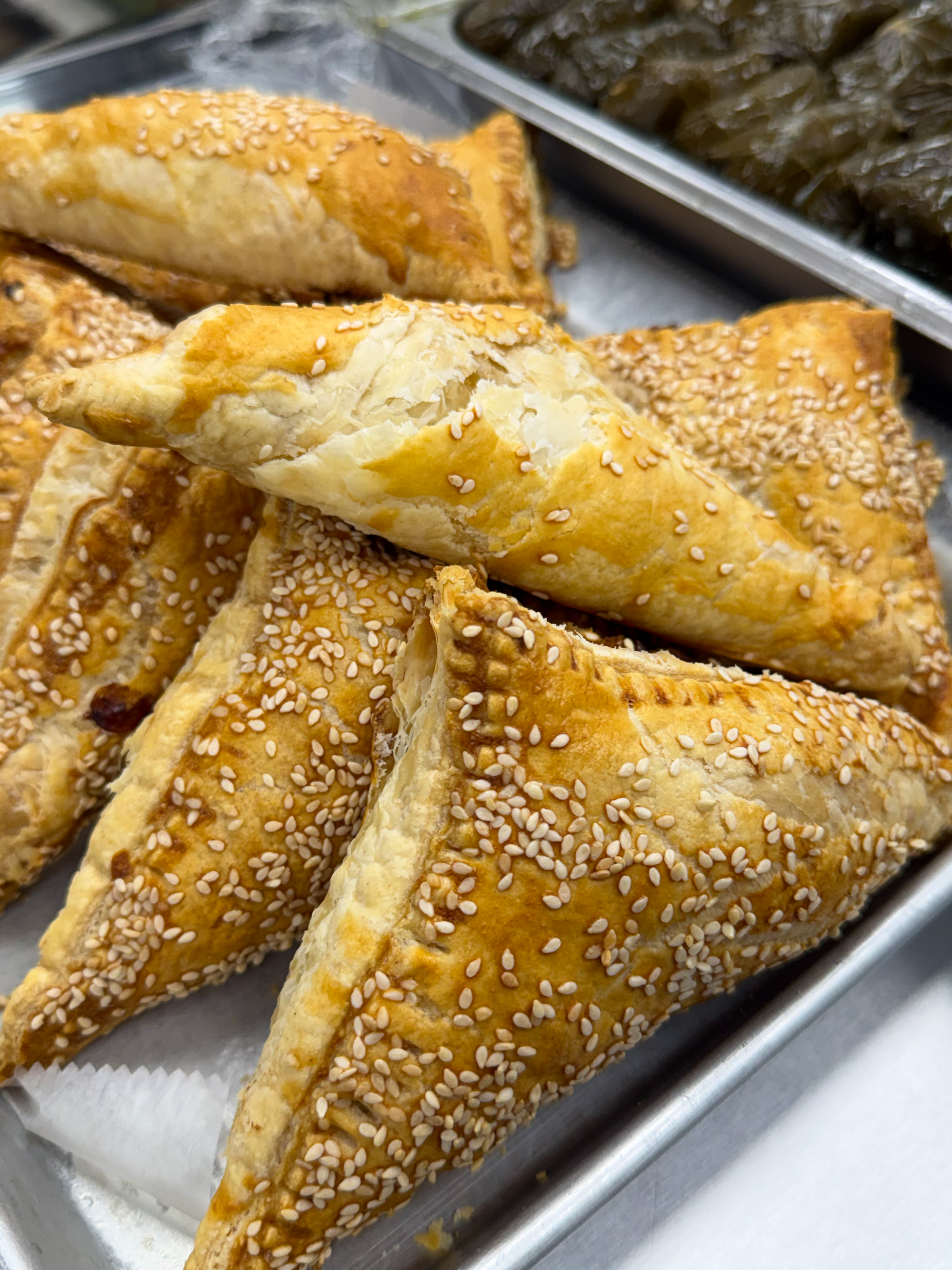Freshly prepared kosher foods including bourekas and deli items made daily
